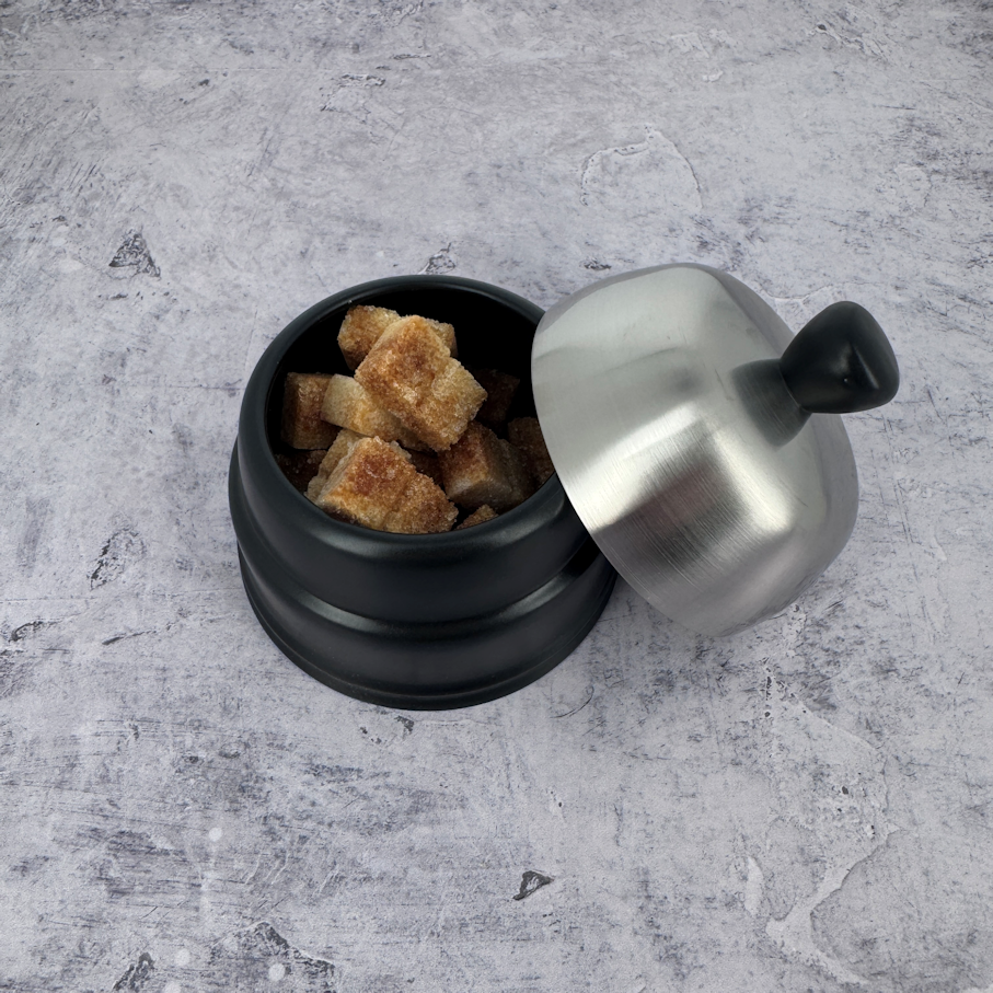 Discover the generous capacity of the Salam black ceramic sugar bowl, perfect for serving cane sugar cubes at the French table.