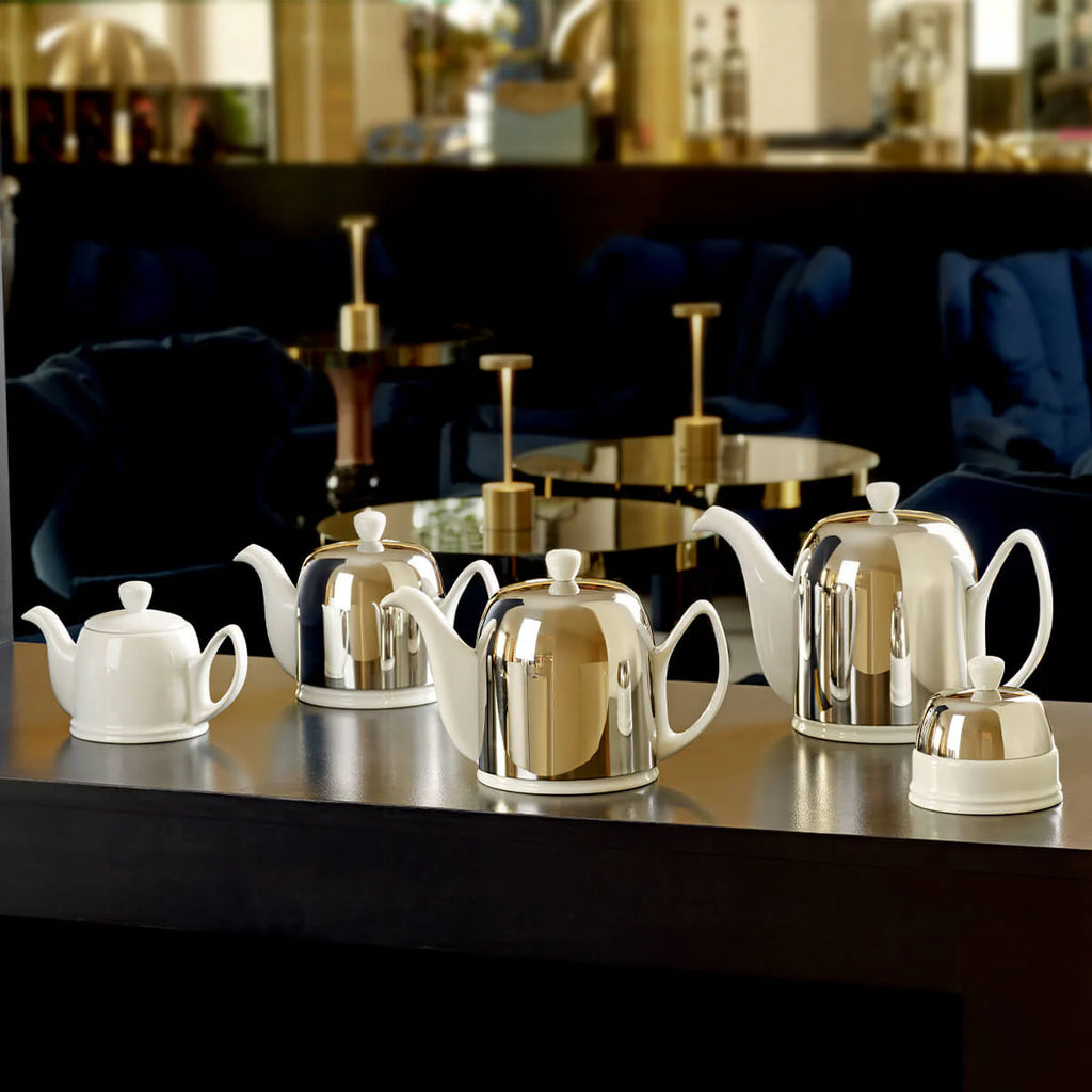 The Salam collection by DEGRENNE: white porcelain teapots and sugar bowl with elegant mirror lids.