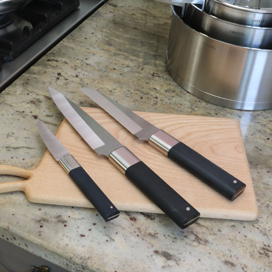 Chef knife set 3 pieces ABSOLU by Tarrerias-Bonjean on a cutting board