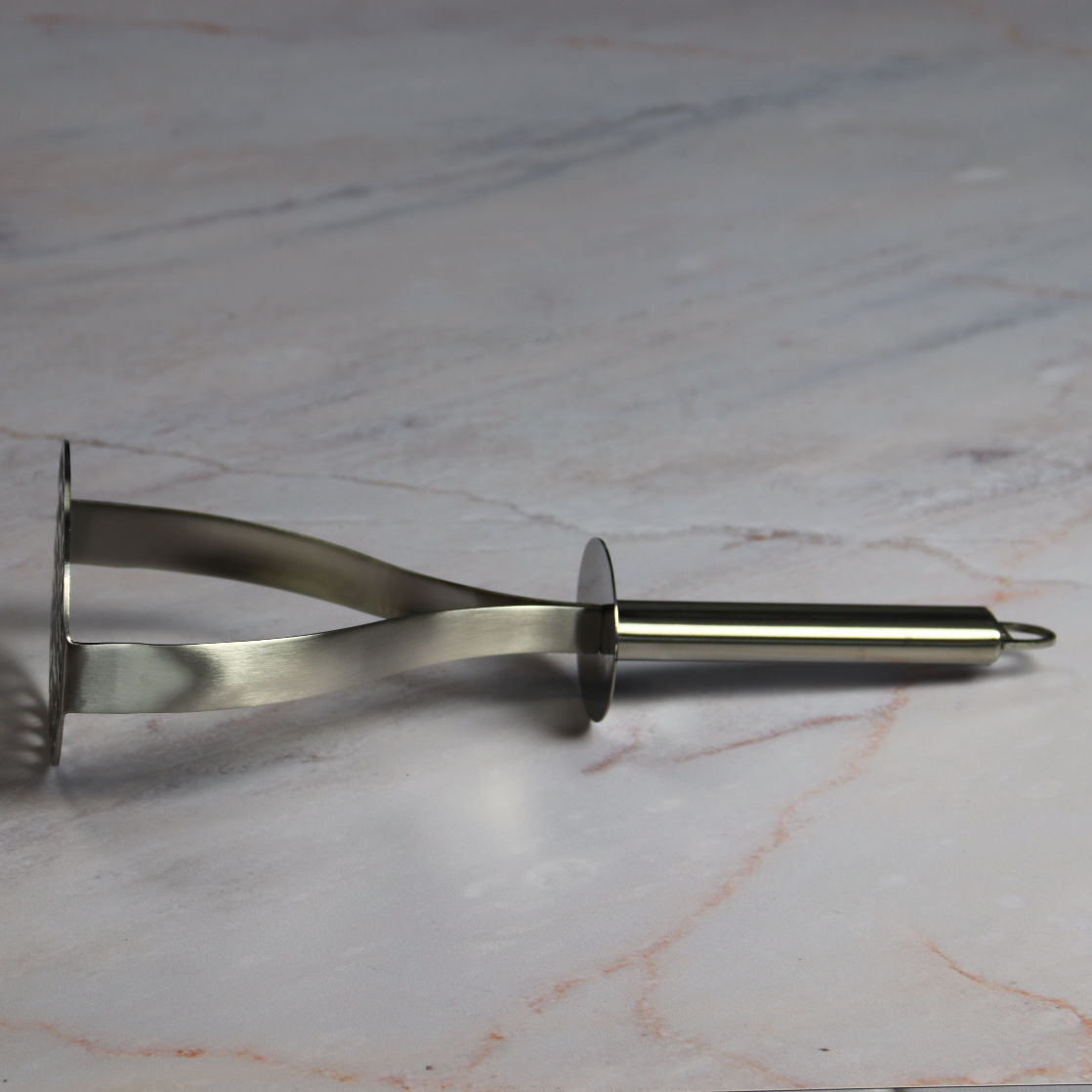 Cristel Potato Masher on Marble