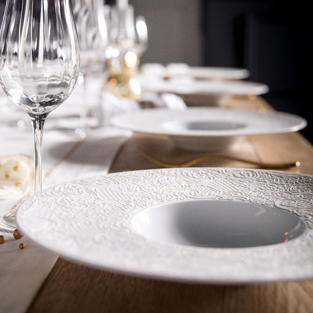 Degrenne round shallow bowls on a wood table