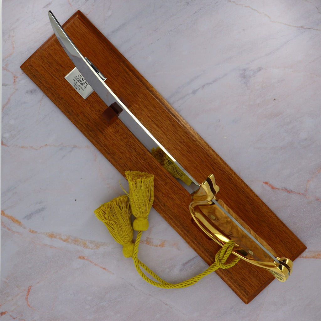 Napoleon champagne opener with olive wood handle on display stand - Claude Dozorme