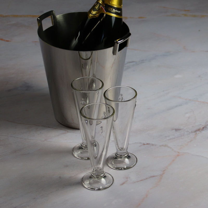 La Rochere champain Flutes Abeille and a bottle of champagne in its bucket